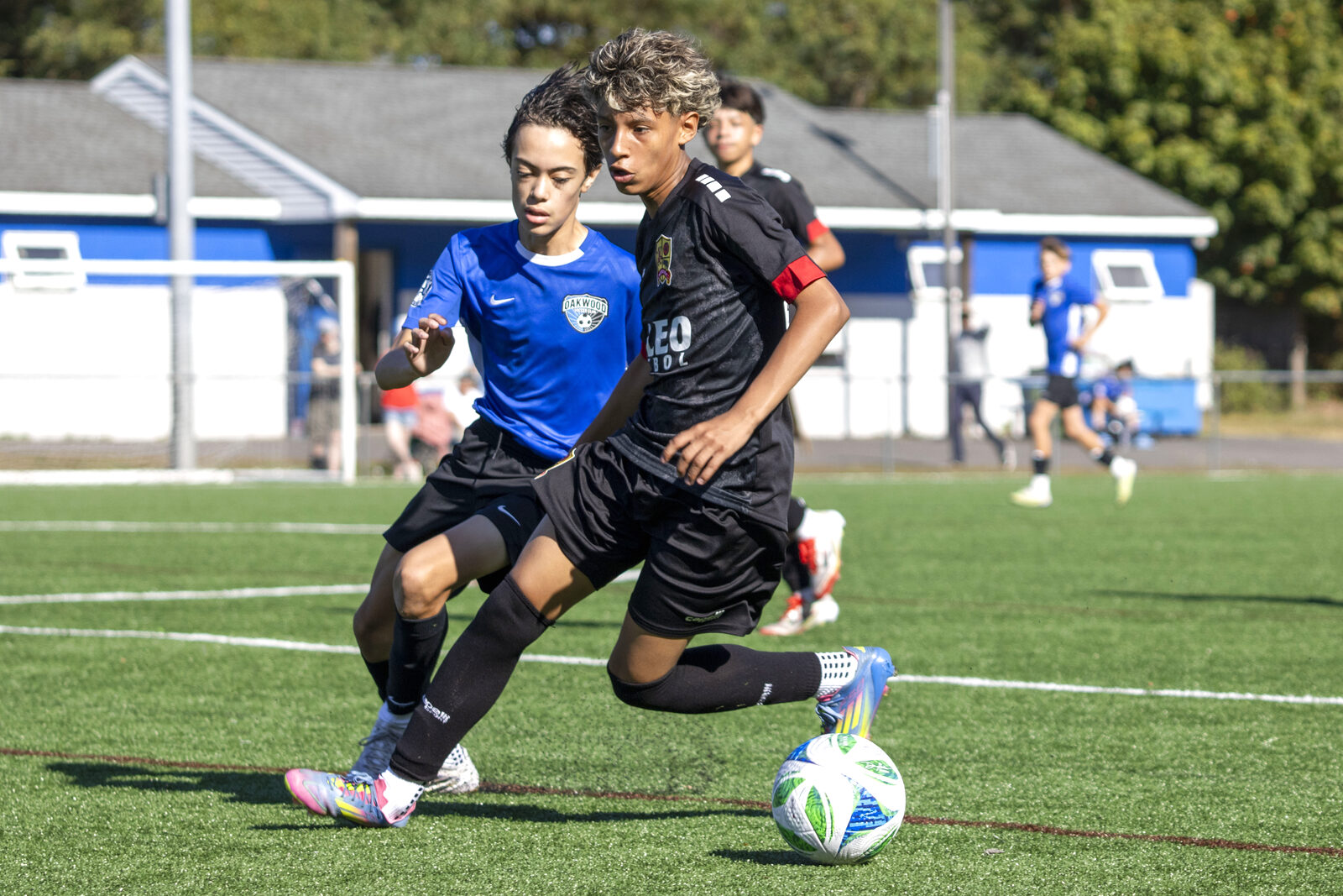 Two Valeo FC players competing for the ball