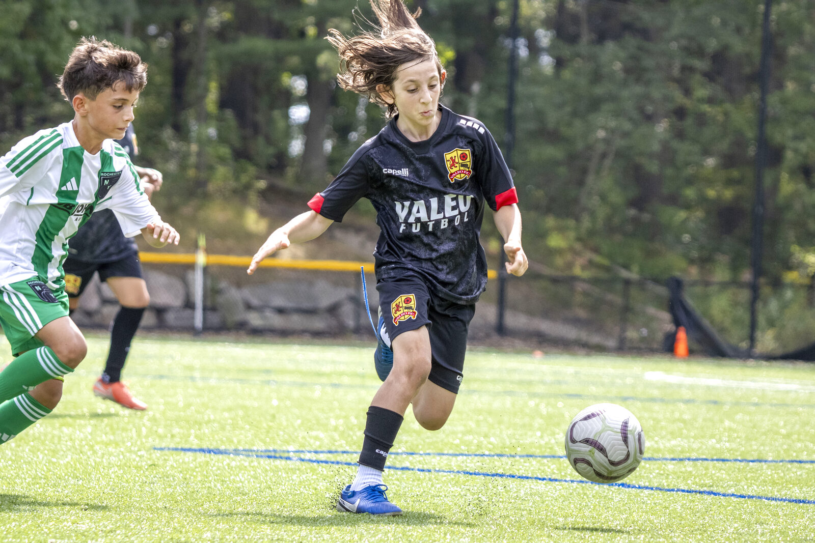 Valeo FC girls program player dribbling