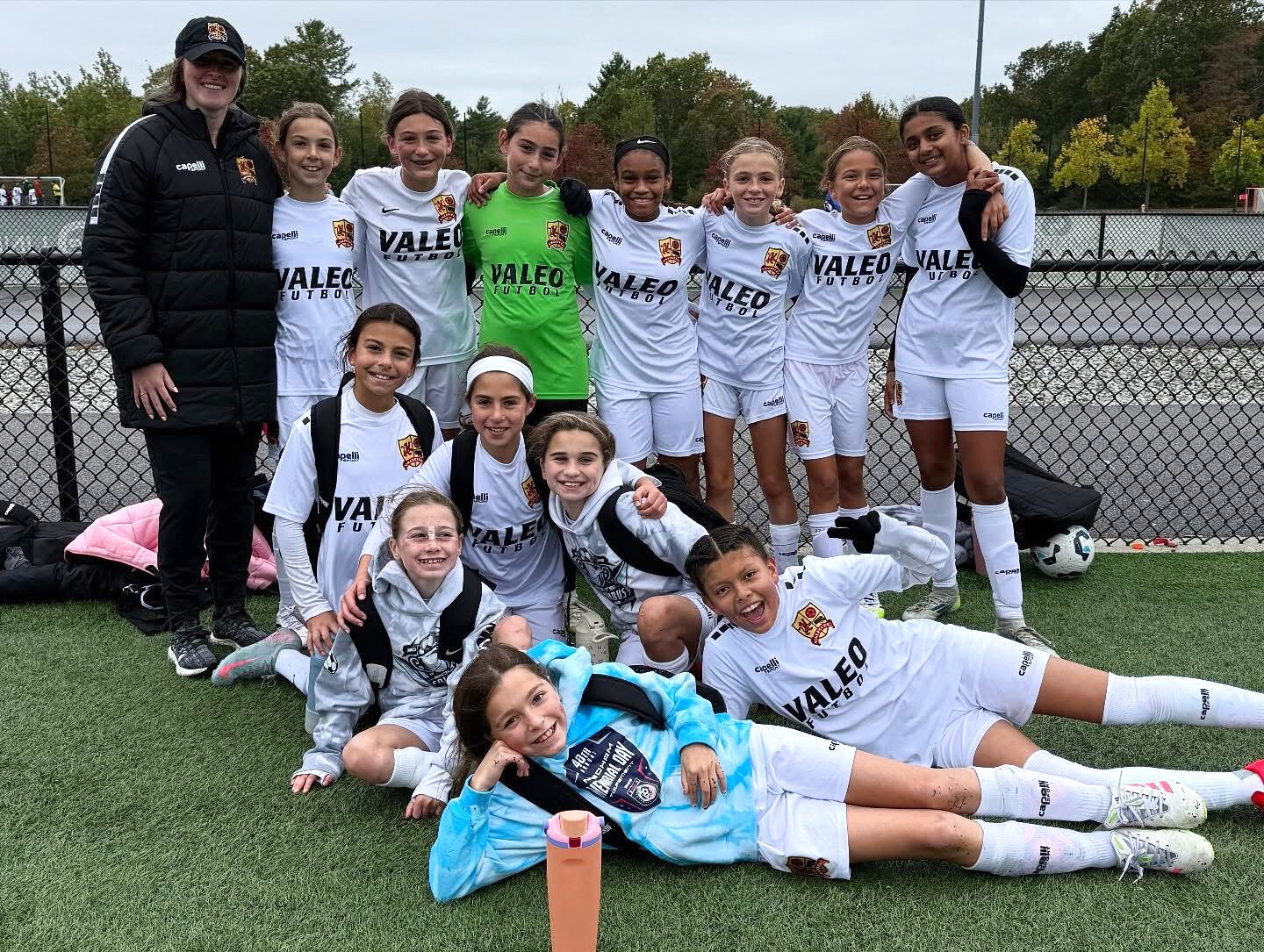 Valeo FC girls team with their coach